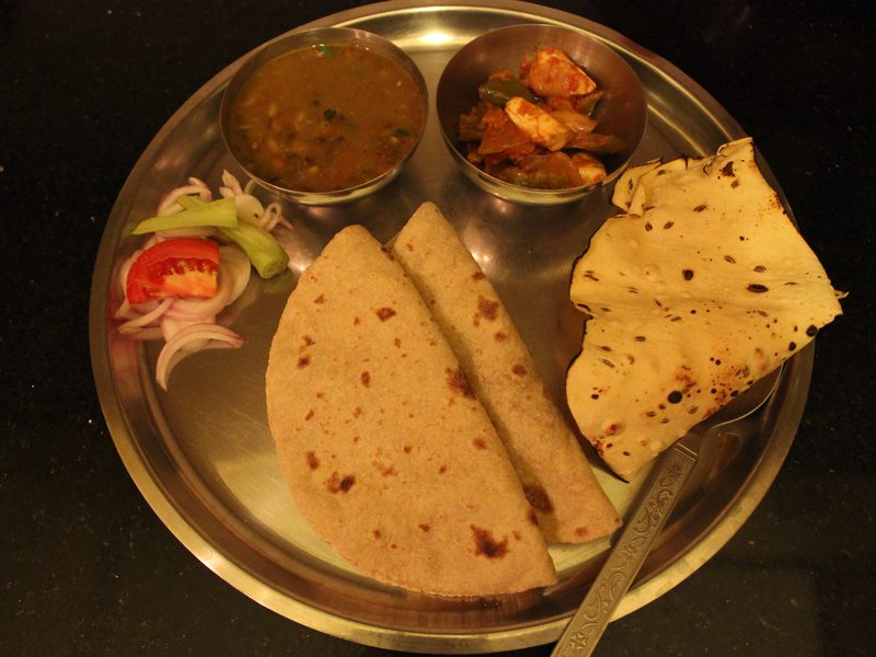 Punjabi thali with dal, sabzi, roti, rice, salad and pickle